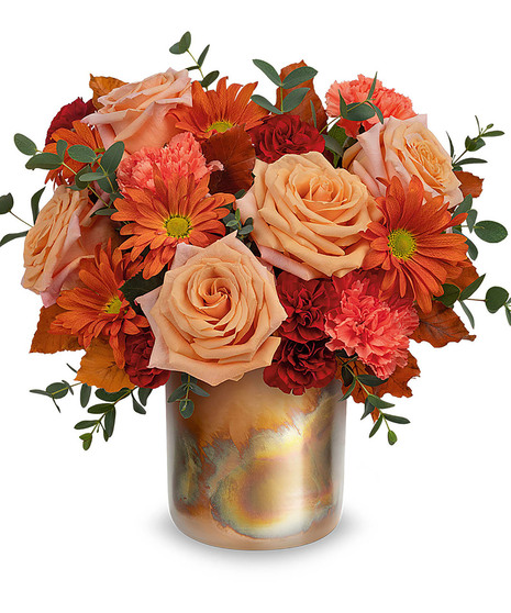 fall-toned floral arrangement with copper container