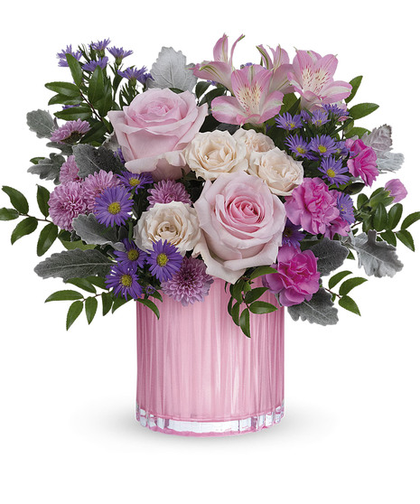 feminine pink flower arrangement in pearlescent vase