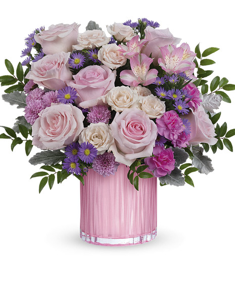 feminine pink flower arrangement in pearlescent vase